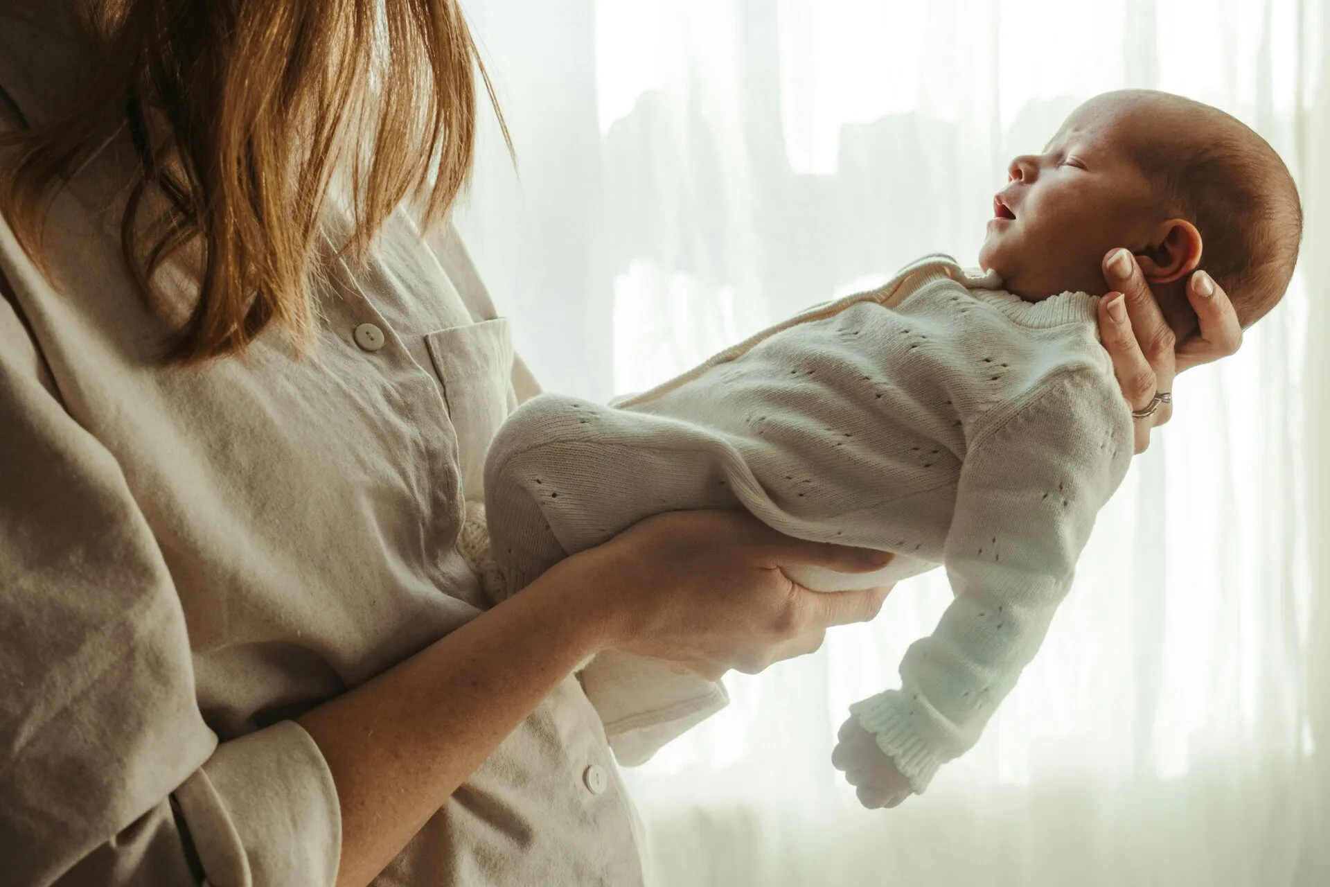 A mother holding her baby